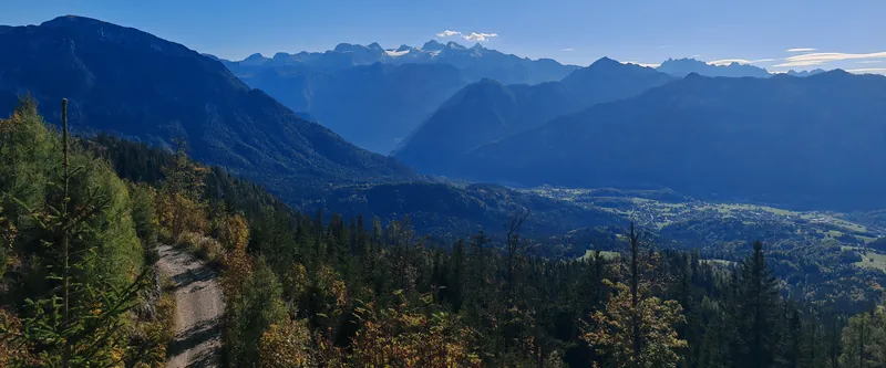 Autumn woodland path above Bad Goisern looking out over the valley and the mountains of the Salzkammergut